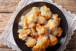 Fried cauliflower in breading close-up. Horizontal top view photo