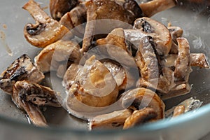 Fried champignons mushrooms close-up. Pizza filling