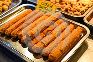 Fried cheese sausages in the street food Jalan Alor in Kuala Lumpur