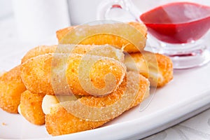 Fried cheese sticks with sauce