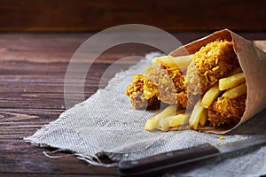 Fried Chicken breast on an old rustic wooden background