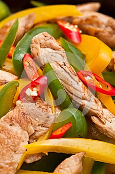 Fried Chicken with capsicum on red table cloth