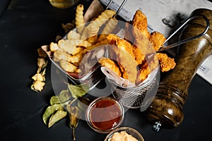 Fried chicken, chicken tenders or fingers served at restaurant with fries and mayo