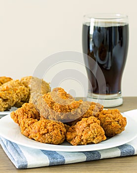 Fried chicken with cola on dining table