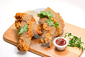 Fried chicken crispy plate wooden board with ketchup on whute background