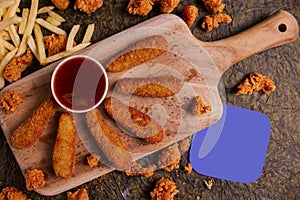 Fried chicken fingers with Ketchup and Copy Space Text Area in Top View