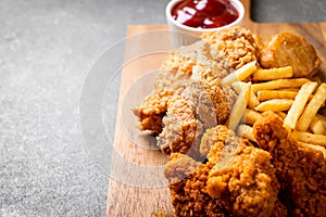 fried chicken with french fries and nuggets meal