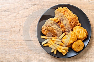 fried chicken with french fries and nuggets meal