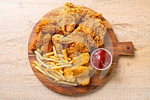 fried chicken with french fries and nuggets meal