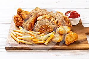 fried chicken with french fries and nuggets meal