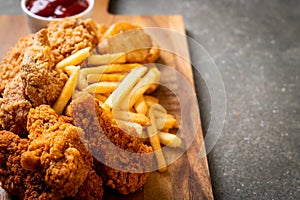 fried chicken with french fries and nuggets meal