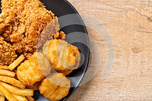 fried chicken with french fries and nuggets meal