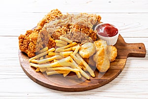 fried chicken with french fries and nuggets meal