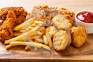 fried chicken with french fries and nuggets meal