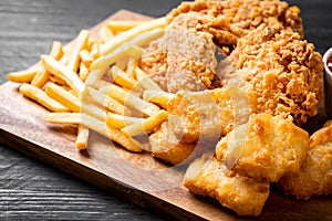 fried chicken with french fries and nuggets meal