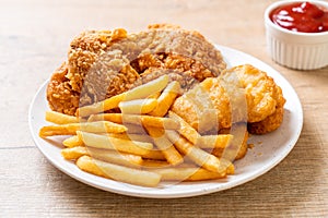 fried chicken with french fries and nuggets meal