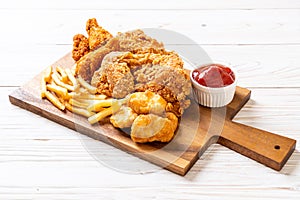 fried chicken with french fries and nuggets meal