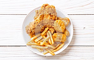 fried chicken with french fries and nuggets meal