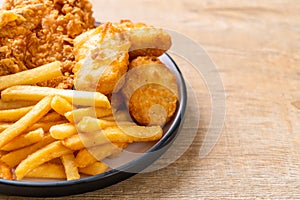 fried chicken with french fries and nuggets meal