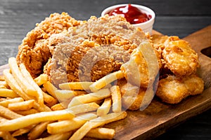 fried chicken with french fries and nuggets meal