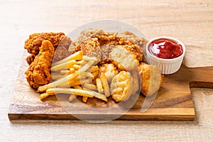 fried chicken with french fries and nuggets meal