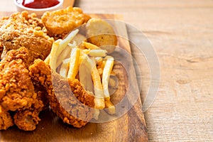 fried chicken with french fries and nuggets meal