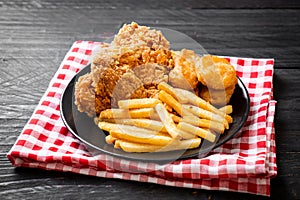 fried chicken with french fries and nuggets meal