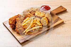 fried chicken with french fries and nuggets meal