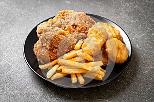 fried chicken with french fries and nuggets meal