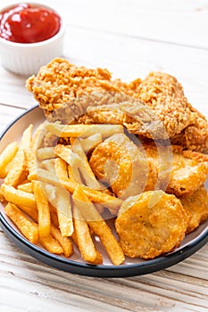 fried chicken with french fries and nuggets meal