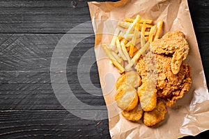 fried chicken with french fries and nuggets meal