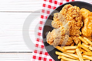 fried chicken with french fries and nuggets meal