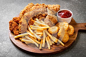 fried chicken with french fries and nuggets meal