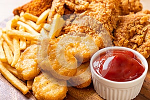 fried chicken with french fries and nuggets meal