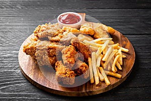 fried chicken with french fries and nuggets meal