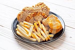 fried chicken with french fries and nuggets meal