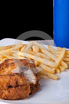 Fried Chicken and fried potato in plate and soft drink
