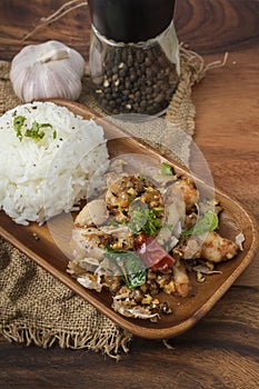 Fried chicken with garlic and pepper with rice. Thai Dish