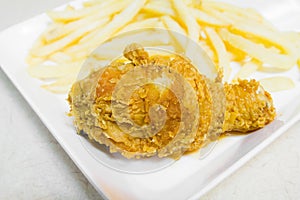 Fried chicken leg with potato chips