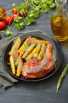 Fried chicken leg and potato wedges