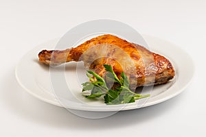 Fried chicken leg with on a white plate