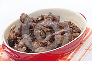 Fried chicken liver served in a red bowl