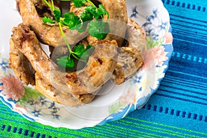 Fried chicken necks with onions and cilantro