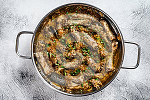 Fried Chicken Necks with vegetables. Gray background. Top view