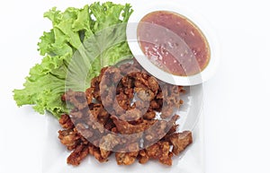 Fried chicken skin on white background