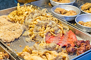 Fried chicken and squid at traditional market in Taiwan photo