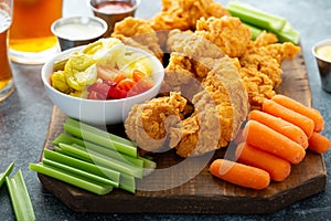 Fried chicken tenders with veggies