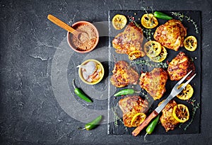Fried Chicken Thighs on a slate tray photo