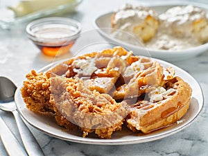 Fried chicken and waffles breakfast with syrup