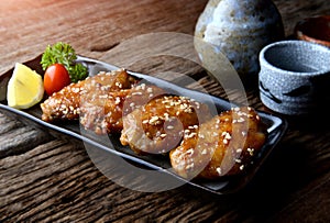 Fried chicken wing with spicy sauce in Japanese style. photo